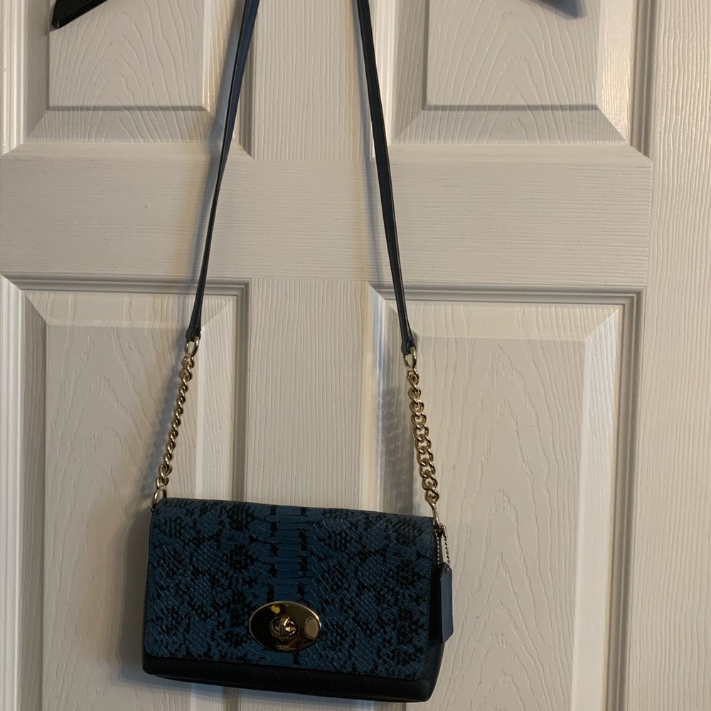 Blue snake patterned cross body bag